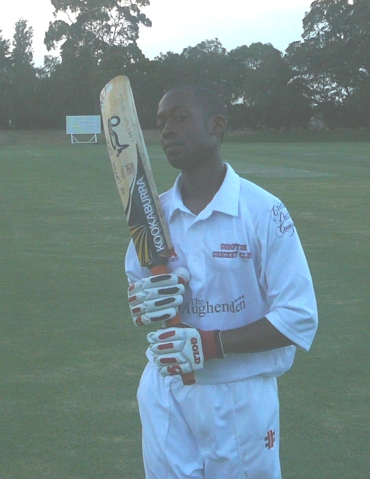 Bryan Robbins holds a bat